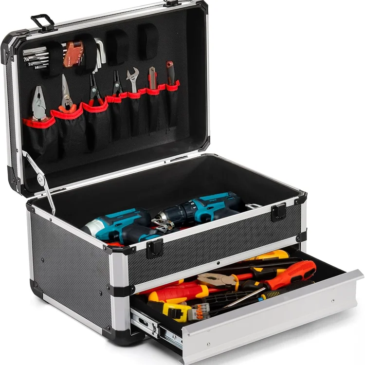 Open portabletoolchest with organized hand tools and power drills